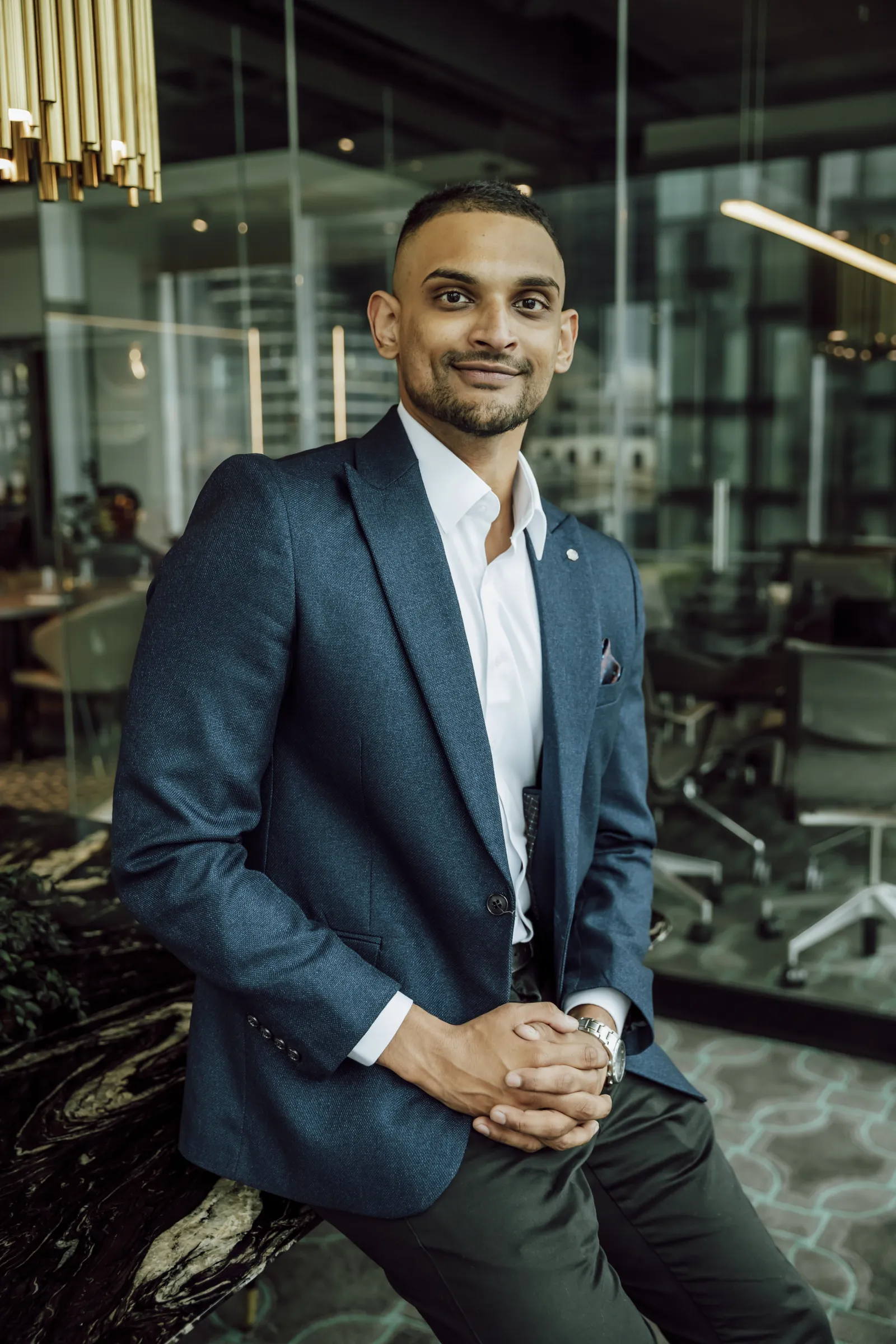 Tav Palapathwala seated in the Collins Street office.